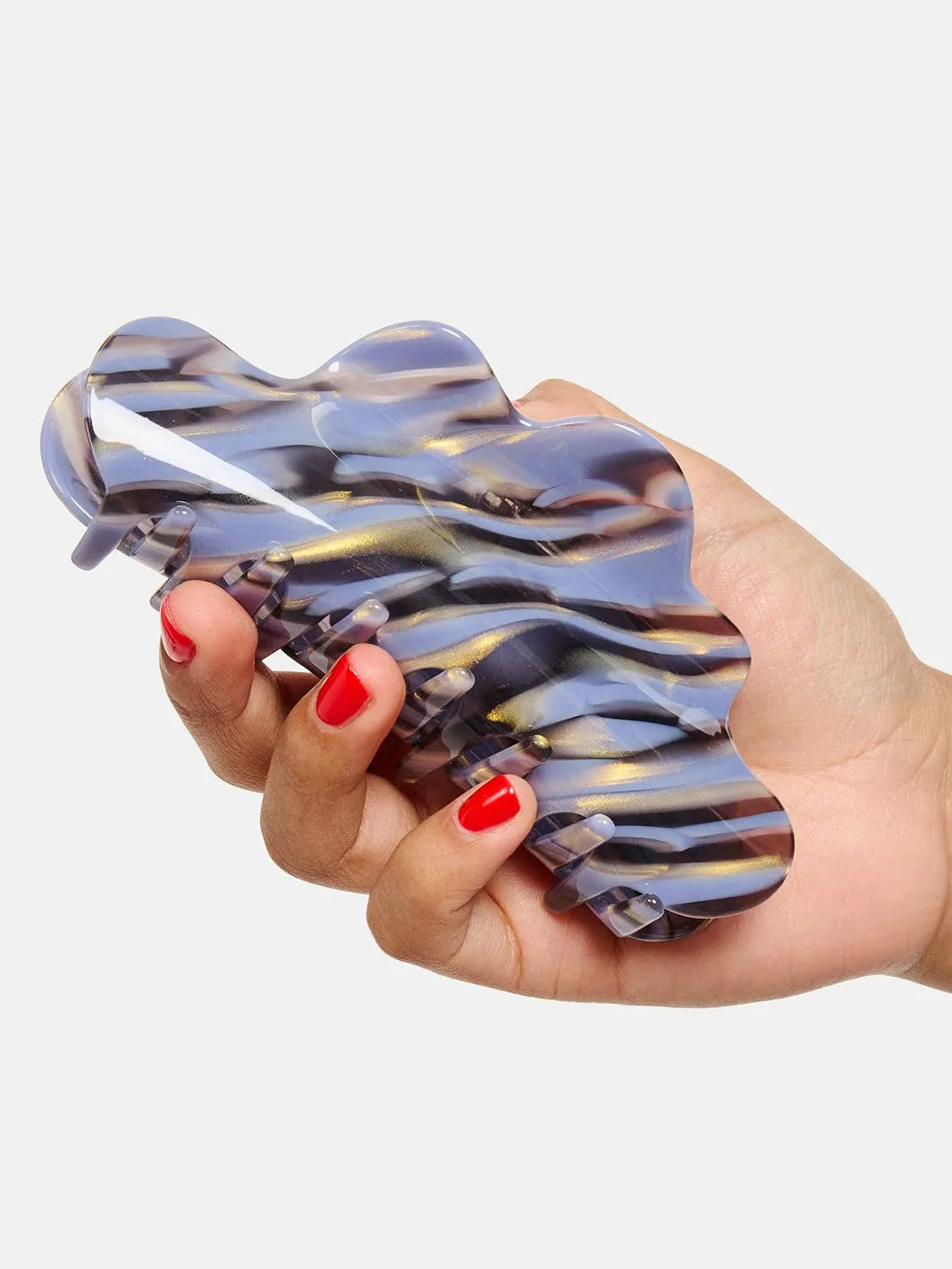 Chunks Nimbus Claw in Phantom held in hand, showing its oversized wavy shape and marbled finish | Twentyseven Toronto