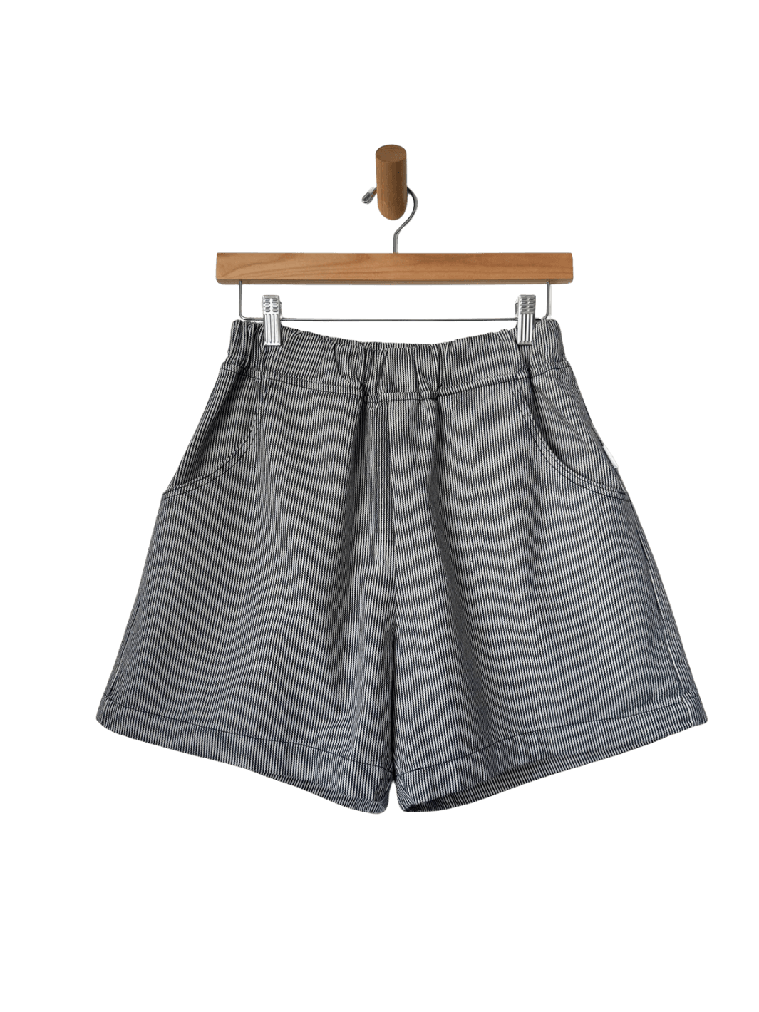 Le Bon Shoppe City Shorts in 'Blue Stripe' on a wooden hanger against a transparent background | Twentyseven Toronto