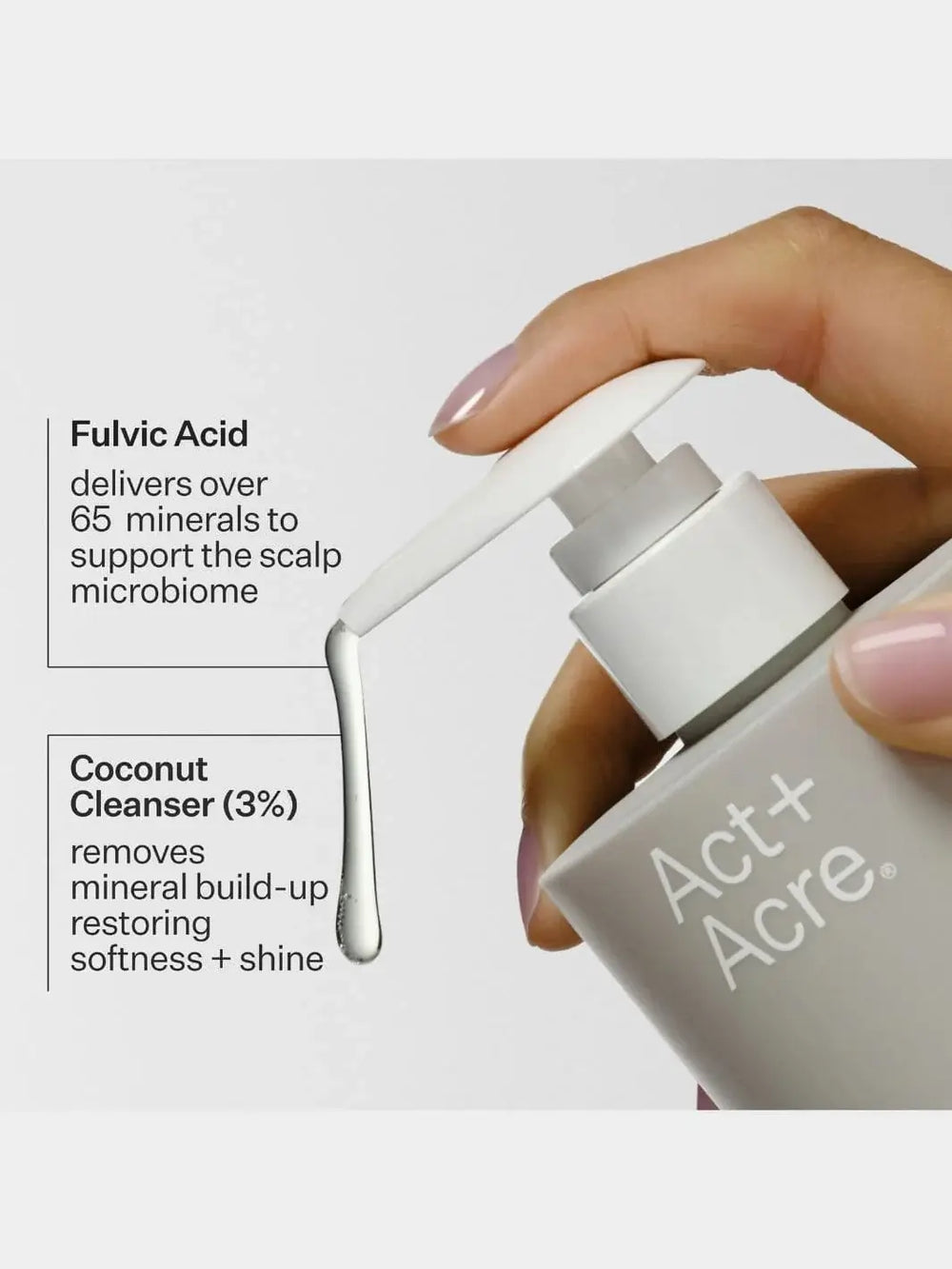 Hand holding a bottle of Act+Acre Clarifying Hard Water Shampoo with text detailing benefits of Fulvic Acid and Coconut Cleanser | Twentyseven Toronto