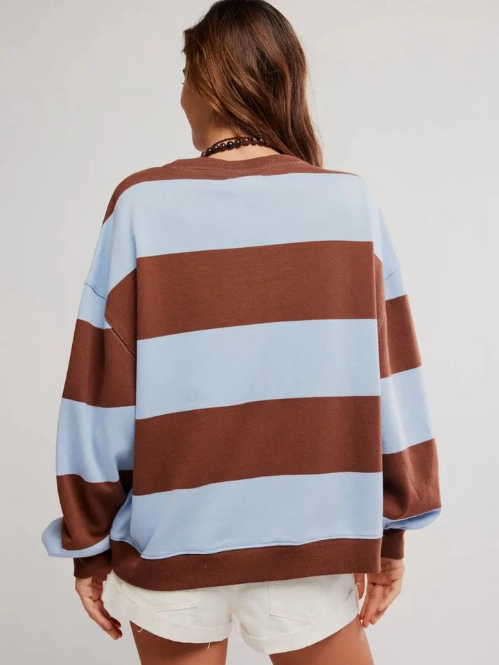 A full rear view emphasizes the generous, wide silhouette and continuous striped pattern of the Free People Classic Stripe Crew Wide in Periwinkle Combo | Twentyseven Toronto