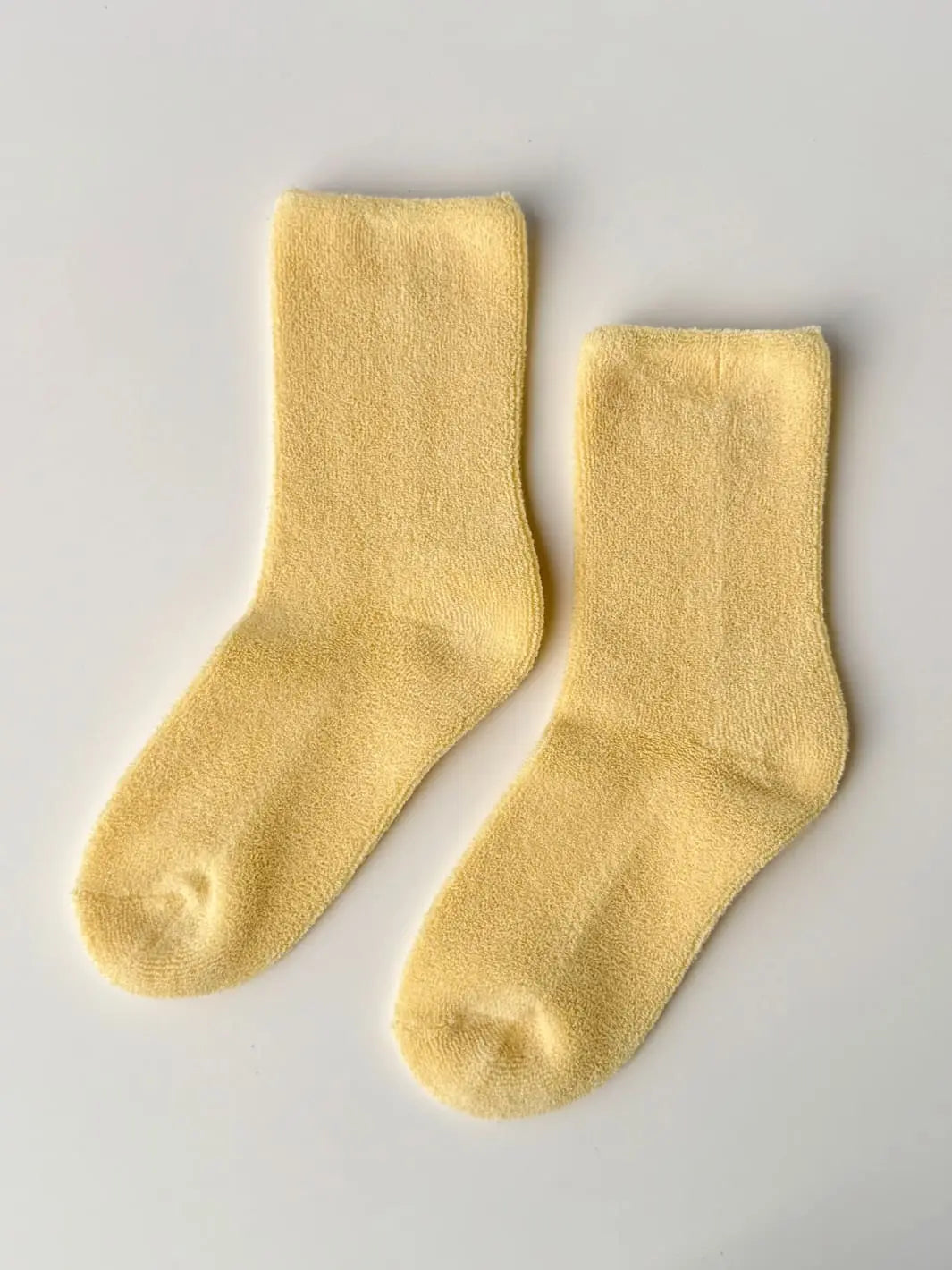 Pair of yellow Cloud Socks in 'Lemon Water' from Le Bon Shoppe, flatlay | Twentyseven Toronto