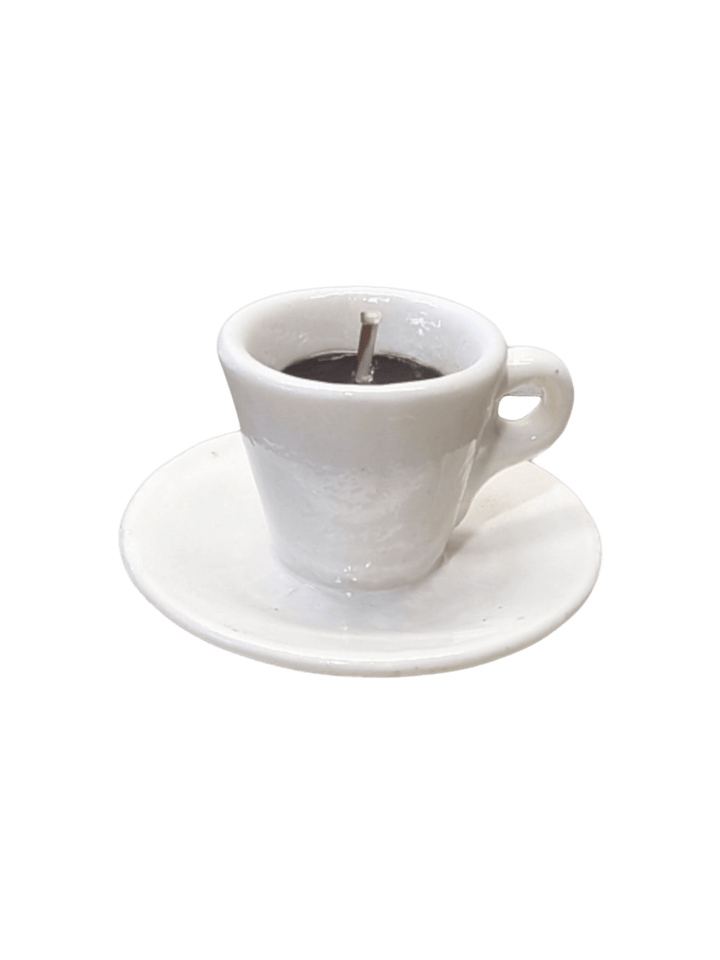 White coffee cup and saucer shaped candle from Cereria Introna on a transparent background | Twentyseven Toronto