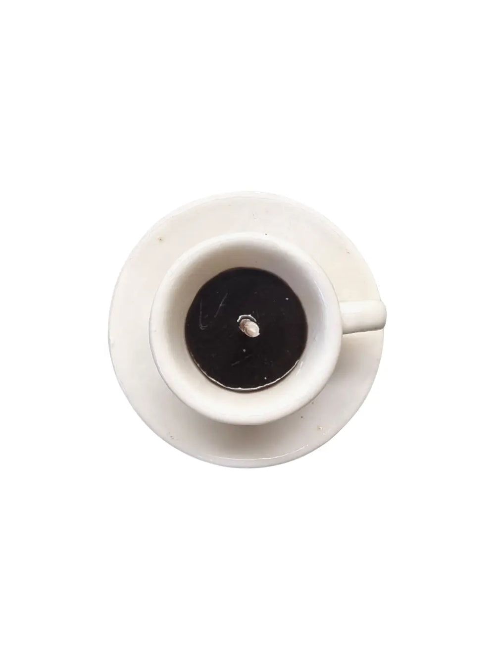 Top view of white coffee cup and saucer shaped candle from Cereria Introna on a white background | Twentyseven Toronto