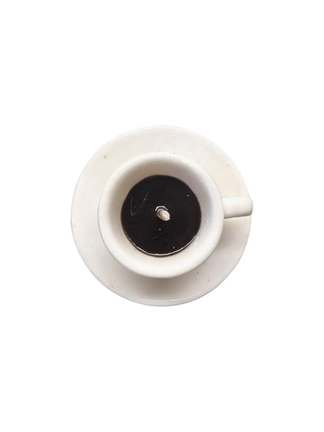 Top view of white coffee cup and saucer shaped candle from Cereria Introna on a white background | Twentyseven Toronto