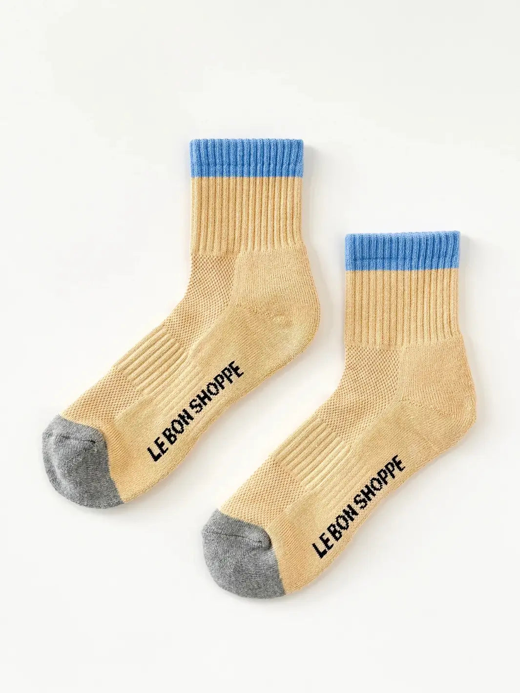 Pair of yellow 'Color Block Girlfriend Socks' with blue accents and gray toes in style 'Yellow Blue' from Le Bon Shoppe on a white background | Twentyseven Toronto