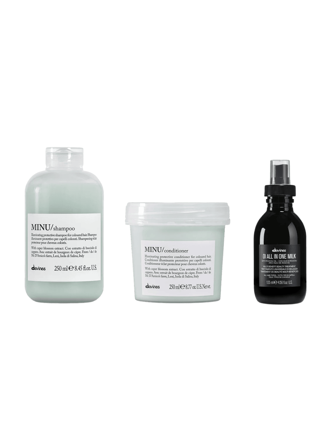 Three Davines hair care products including MINU Shampoo (250ml), MINU Conditioner (250ml) and OI All in One Milk (135ml) on a transparent background | Twentyseven Toronto