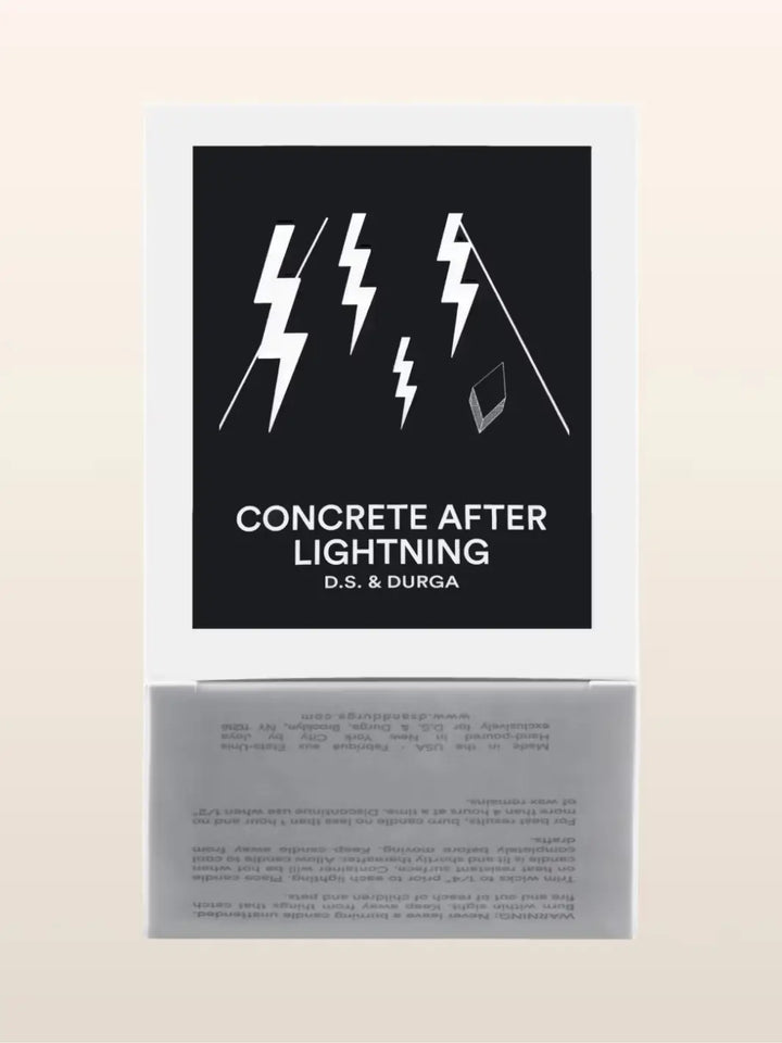 Candle packaging featuring black background and white text featuring 'Concrete After Lightning' by D.S. & Durga | Twentyseven Toronto