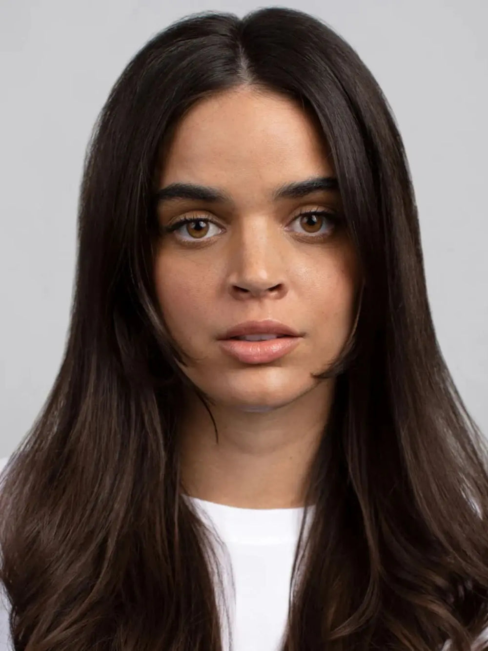 Woman with long dark hair, results of R+Co 'COOL WIND pH Perfect Air Dry Creme' hair product | Twentyseven Toronto