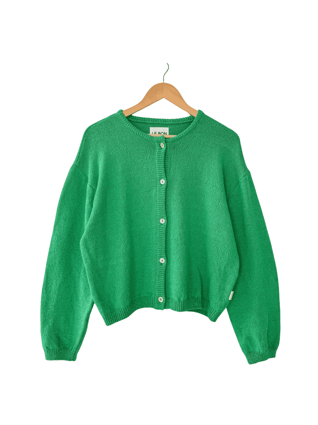 Le Bon Shoppe 'Cotton Leila Cardigan' in 'Spring Green' on a wooden hanger on transparent background | Twentyseven Toronto