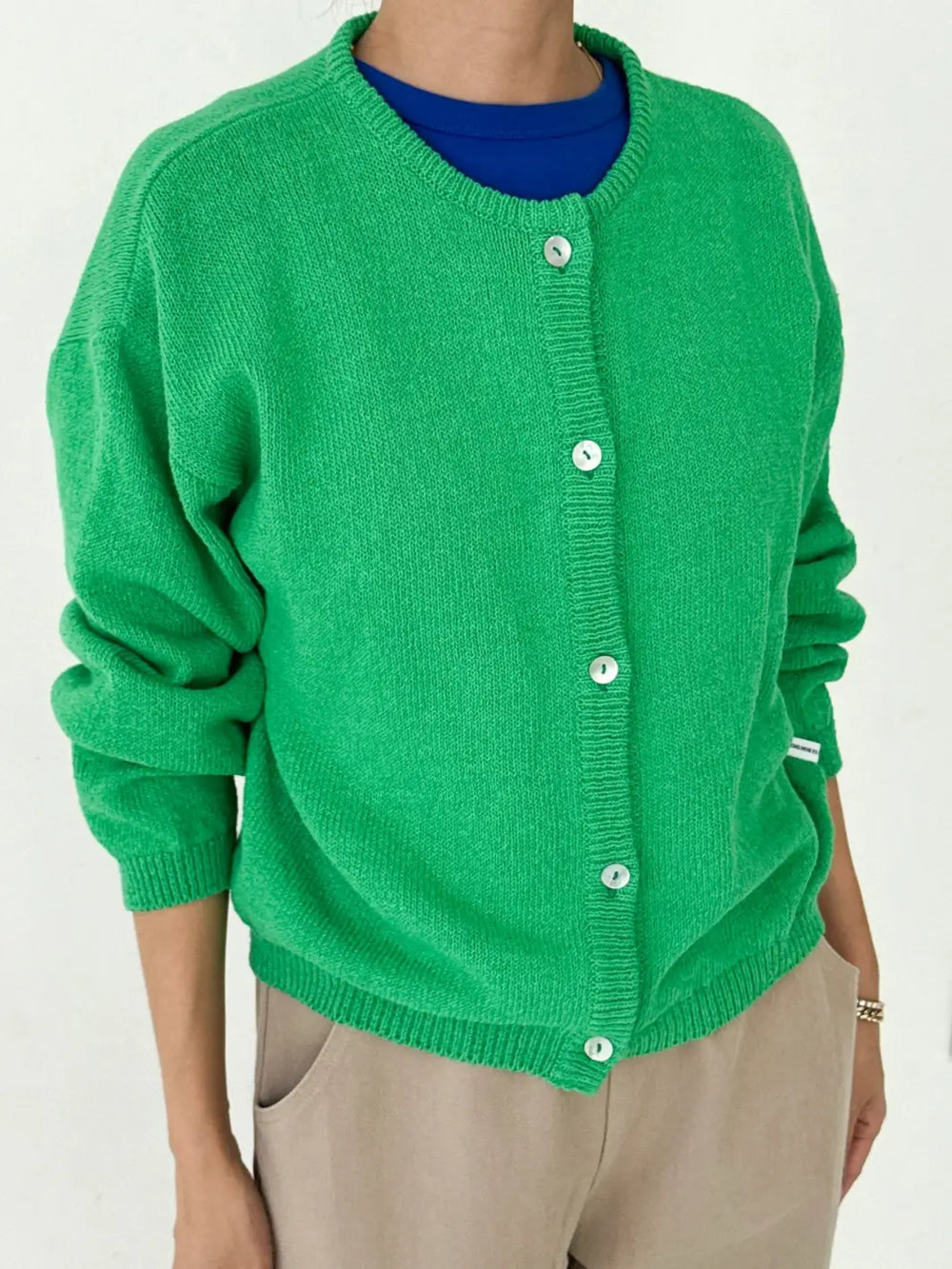 Le Bon Shoppe 'Leila Spring Cardigan' in 'Spring Green' worn by a person on a white background | Twentyseven Toronto