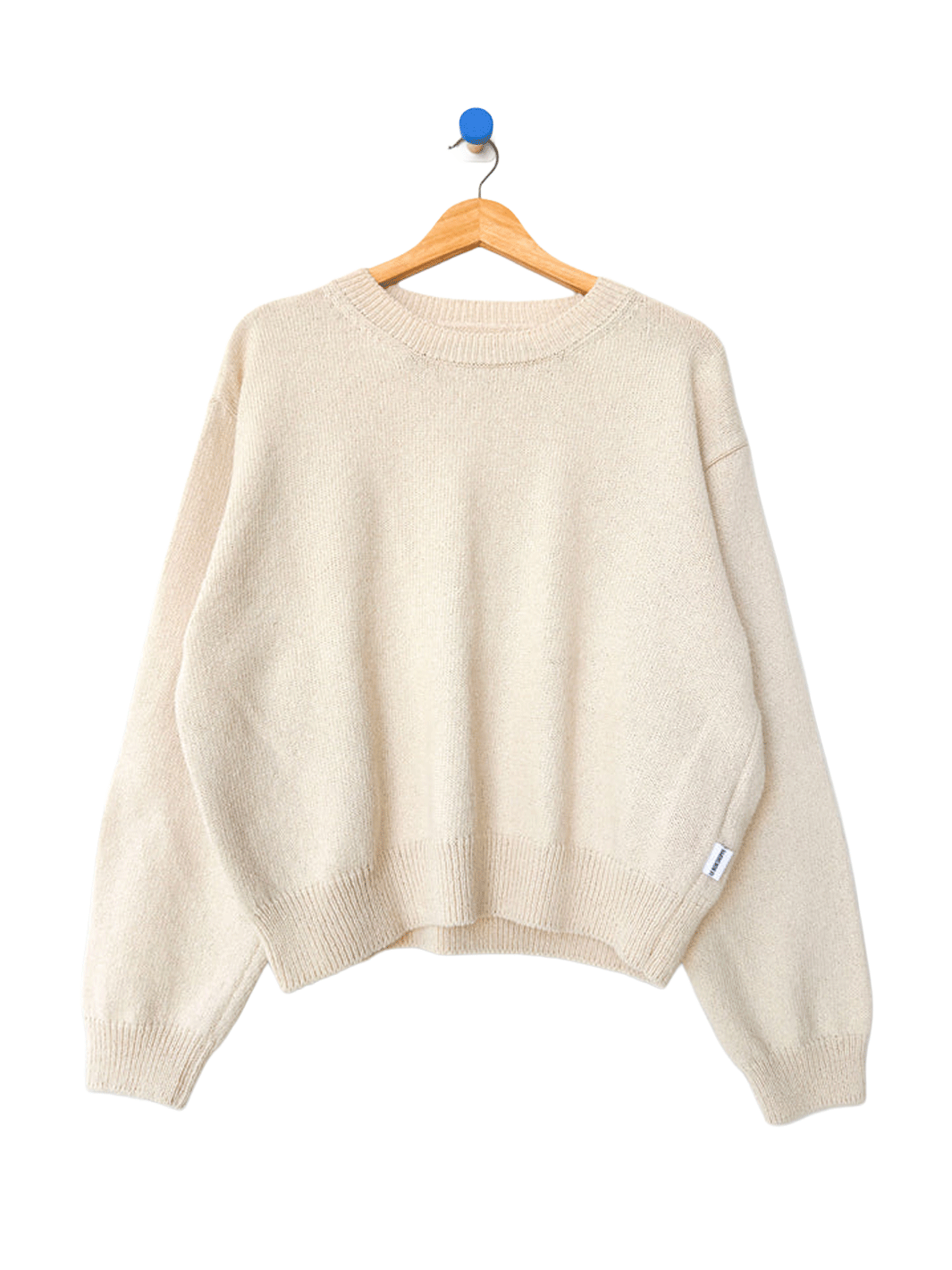 Le Bon Shoppe Milo Cotton Sweater in Natural on a wooden hanger | Twentyseven Toronto