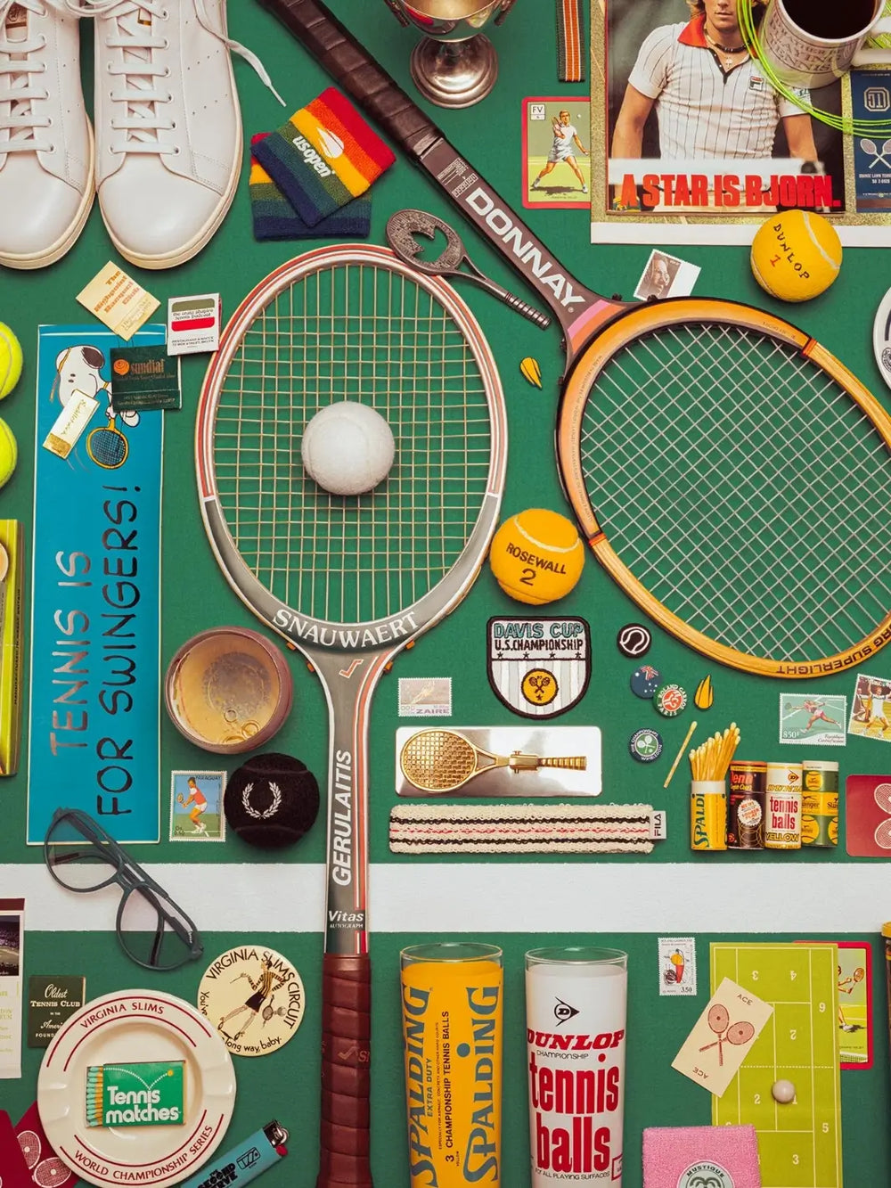 A vibrant, retro flat lay of vintage tennis gear, including wooden rackets, white sneakers, and yellow tennis balls for the Court Classics 1000 Piece Puzzle from Piecework Puzzles | Twentyseven Toronto