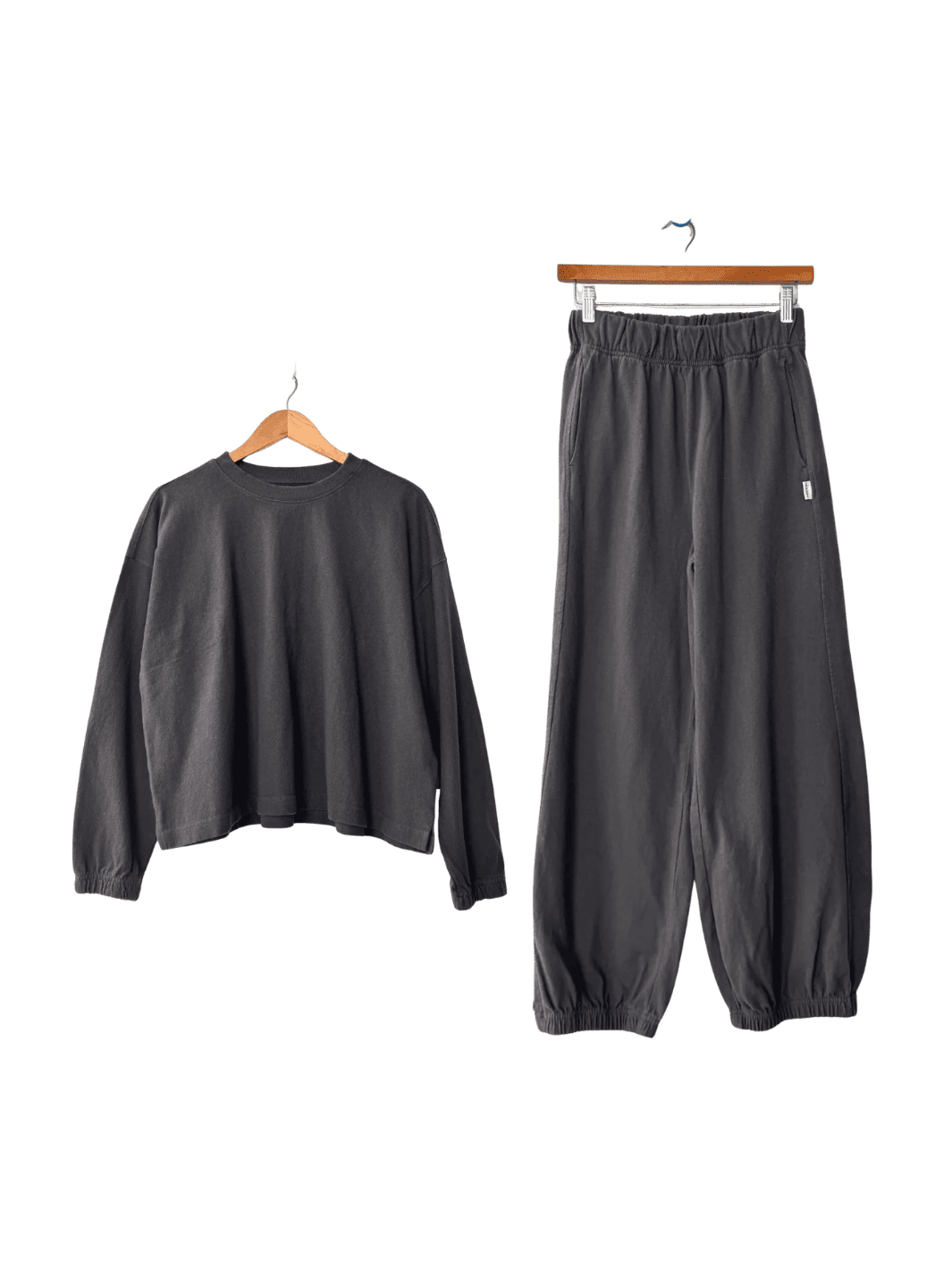 Dark grey Le Bon Shoppe 'Naturelle Tee' sweatshirt and 'Balloon Pants' in 'Dark Slate' set on hangers | Twentyseven Toronto