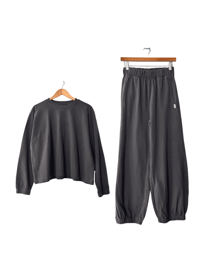 Dark grey Le Bon Shoppe 'Naturelle Tee' sweatshirt and 'Balloon Pants' in 'Dark Slate' set on hangers | Twentyseven Toronto