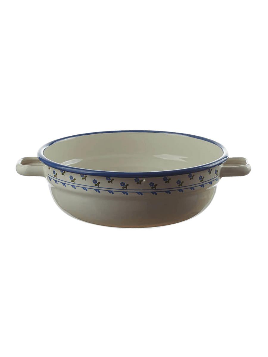 A cream-colored enamel serving bowl with side handles, a blue rim, and a delicate blue floral pattern around the upper exterior, showcasing the Munder Email Cream/Blue Floral Farmhouse Bowl, 20cm | Twentyseven Toronto