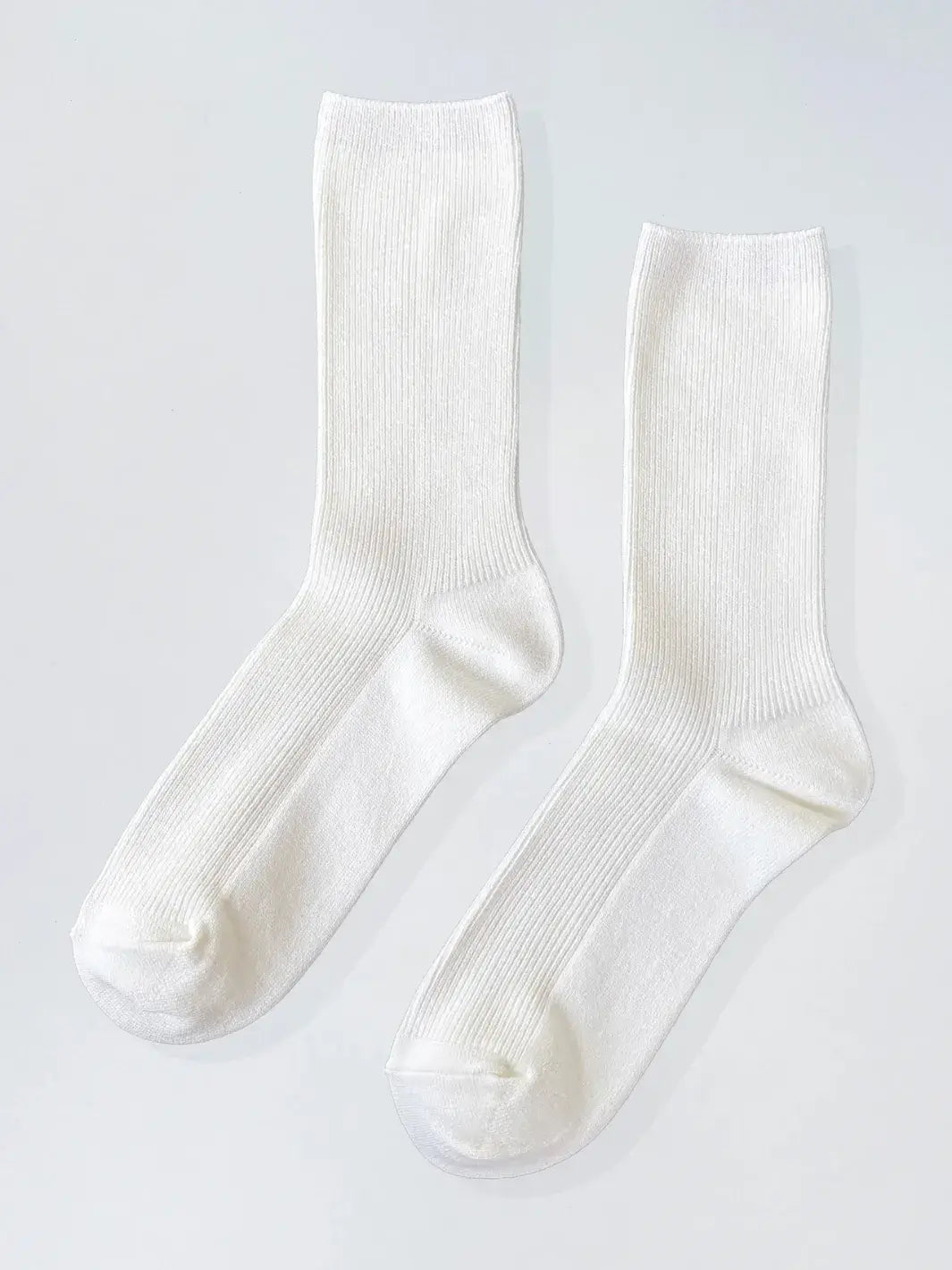 Pair of white 'Crisp Step Socks' from Le Bon Shoppe on a white background | Twentyseven Toronto