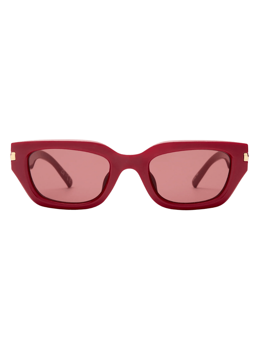 Product shot of red, thick-rimmed Le Specs Cubito + in Burgundy sunglasses on a transparent background | Twentyseven Toronto