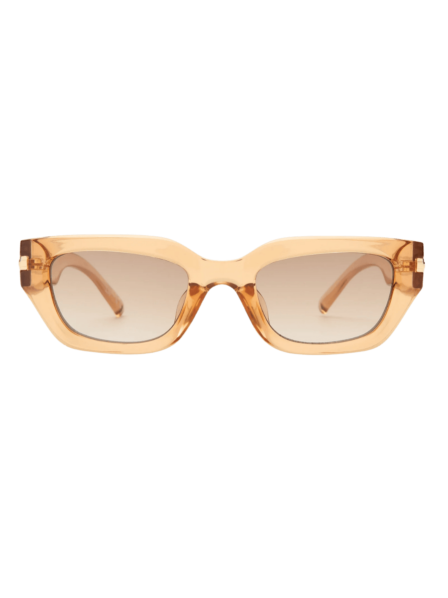 Product shot of gold-rimmed Le Specs Cubito + | Sand sunglasses centered against a transparent background | Twentyseven Toronto