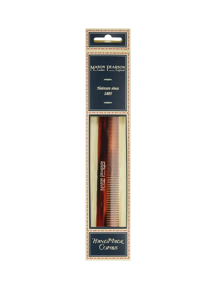 A premium tortoiseshell comb is shown inside its signature navy blue and cream retail packaging to present the product display of the Mason Pearson Cutting Comb C6 | Twentyseven Toronto