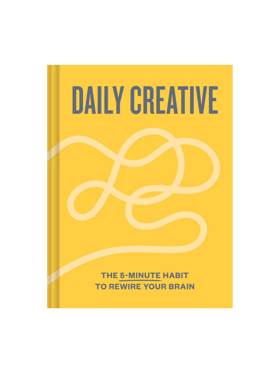 Front cover of the book Daily Creative: The 5-Minute Habit to Rewire Your Brain by Blythe Harris and Mallory May, featuring a white background with a vibrant, abstract splatter of yellow, pink, blue, and black paint across the center | Twentyseven Toronto