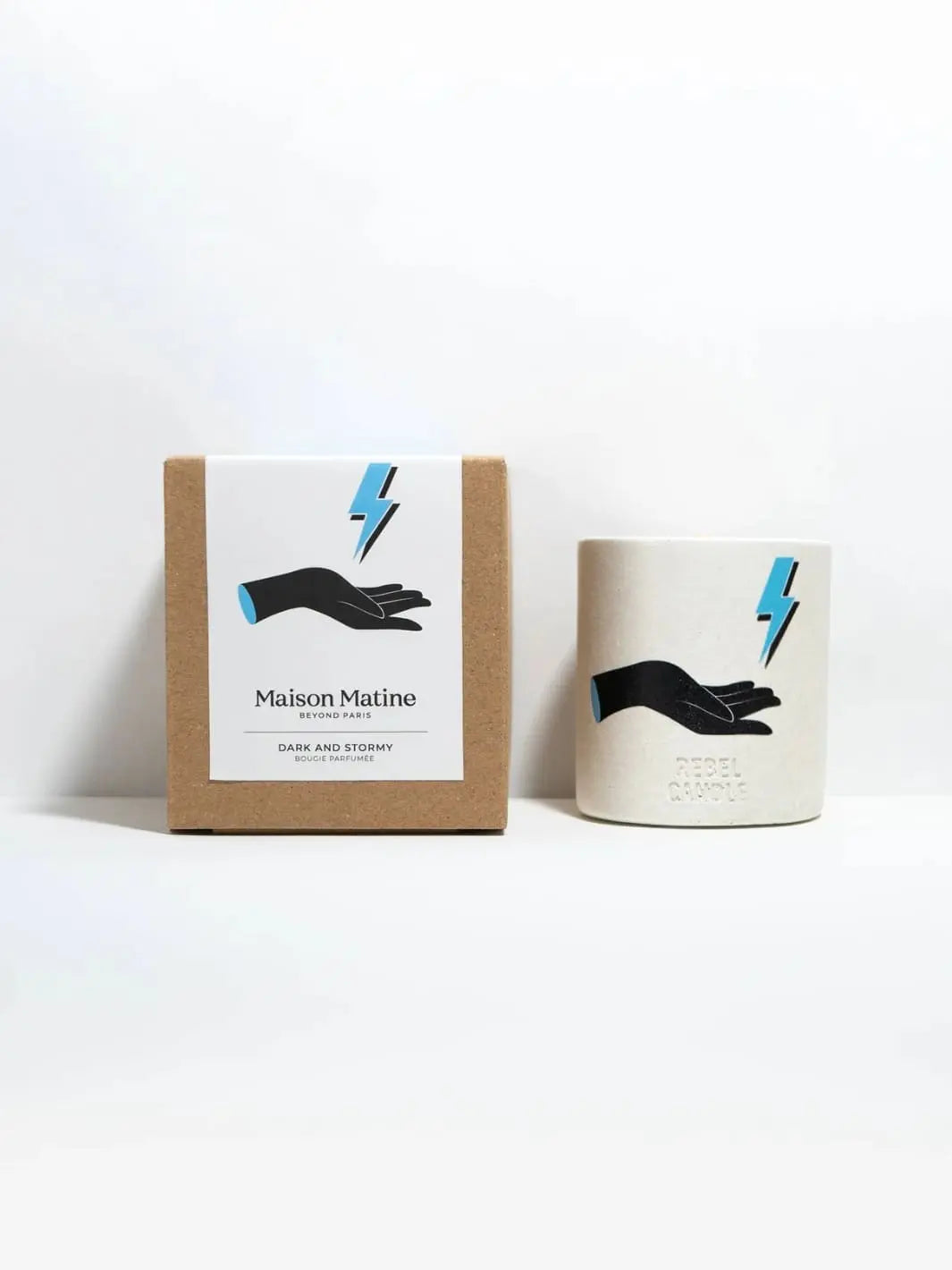 Maison Matine Dark and Stormy Scented Candle and packaging with hand and lightning bolt branding on a white background 160g | Twentyseven Toronto