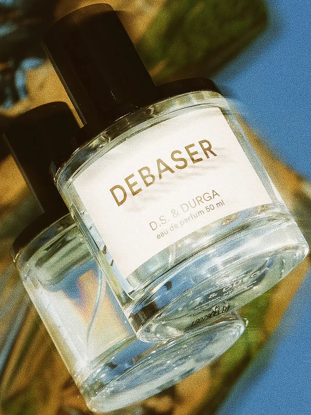 50ml perfume bottle labeled 'Debaser' by D.S. & Durga on a blurred background | Twentyseven Toronto