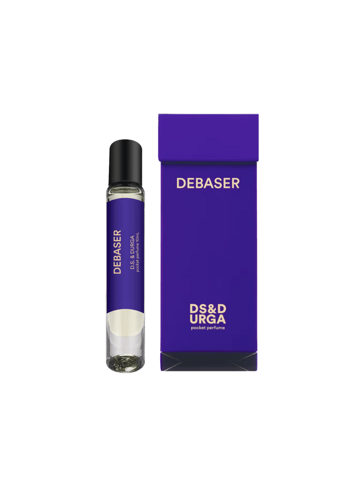 DS&Durga 'Debaser' perfume 10ml roller bottle and purple packaging on a transparent background | Twentyseven Toronto