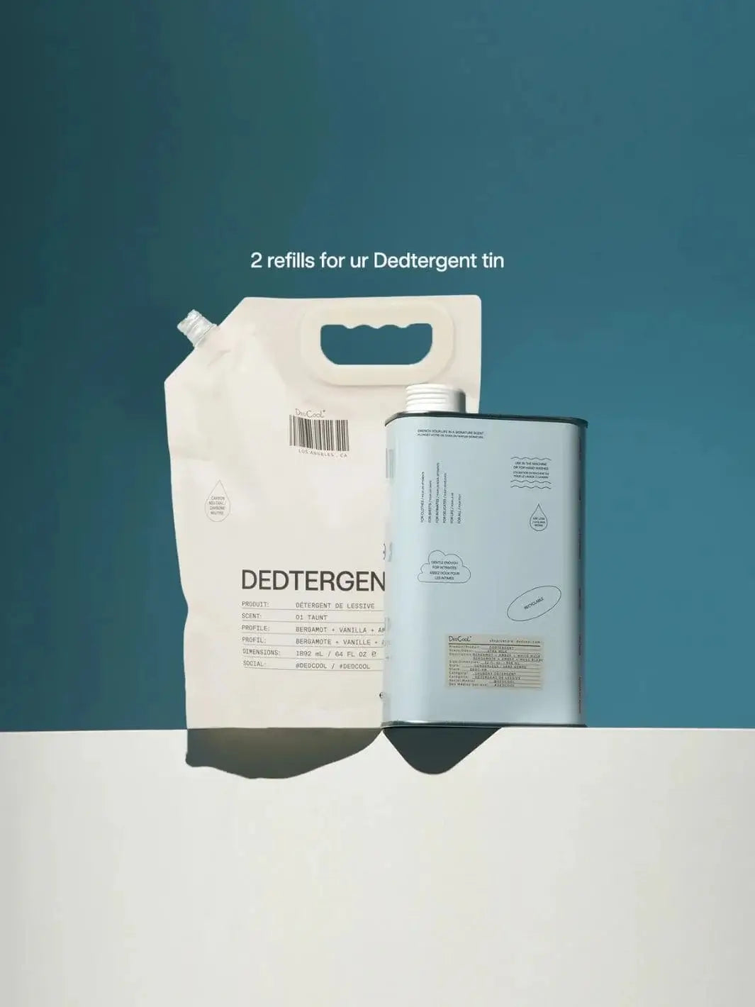 A flexible pouches pack of Dedcool Dedtergent Refill 01 "Taunt" stands next to a metal laundry detergent tin against a solid teal background | Twentyseven Toronto