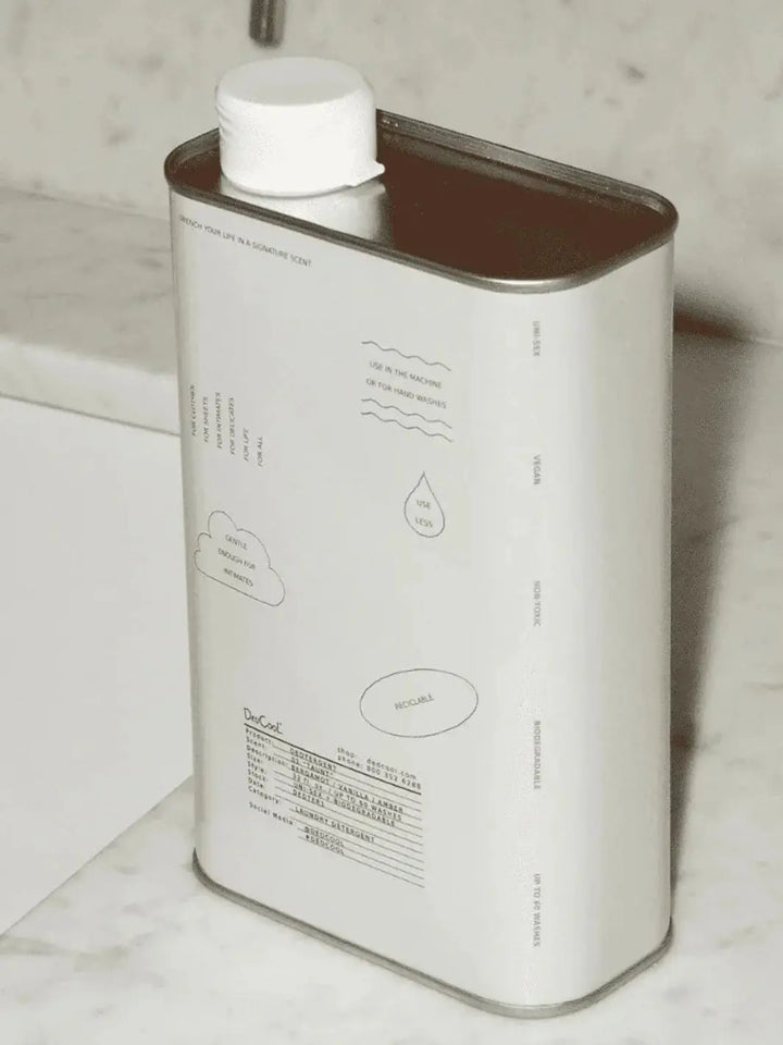 A white metal container of Dedcool Dedtergent 01 "Taunt" is shown from an angle on a white marble countertop | Twentyseven Toronto