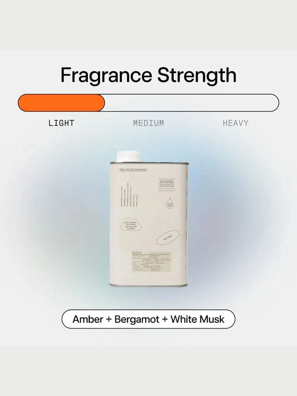 An aluminum tin of Dedcool Dedtergent Xtra Milk is centered beneath an orange graphic bar indicating a light fragrance strength | Twentyseven Toronto