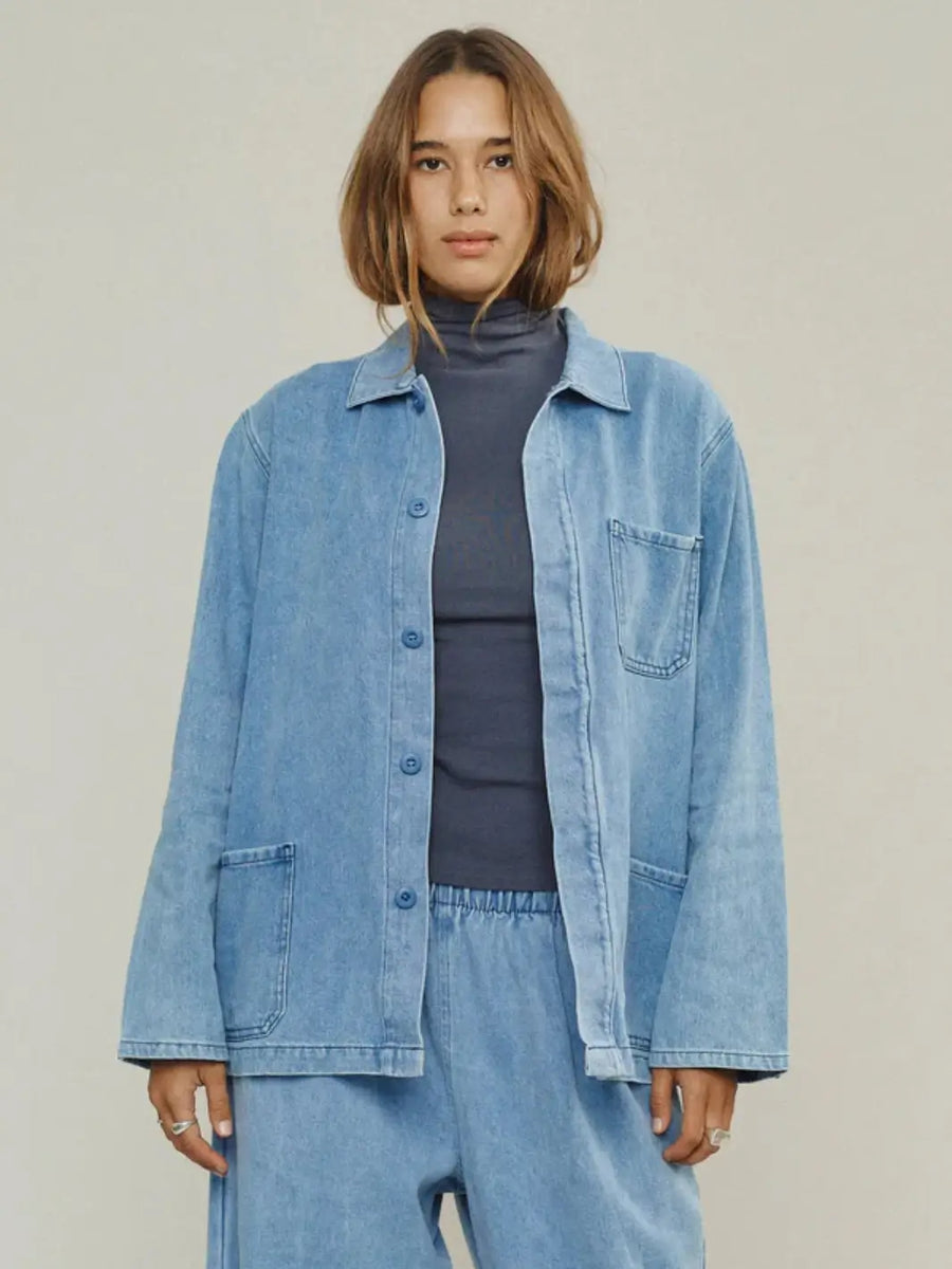 A cropped front view highlights the classic collar, button-down closure, and lightweight wash of the Jungmaven Denim Olympic Jacket in Light | Twentyseven Toronto