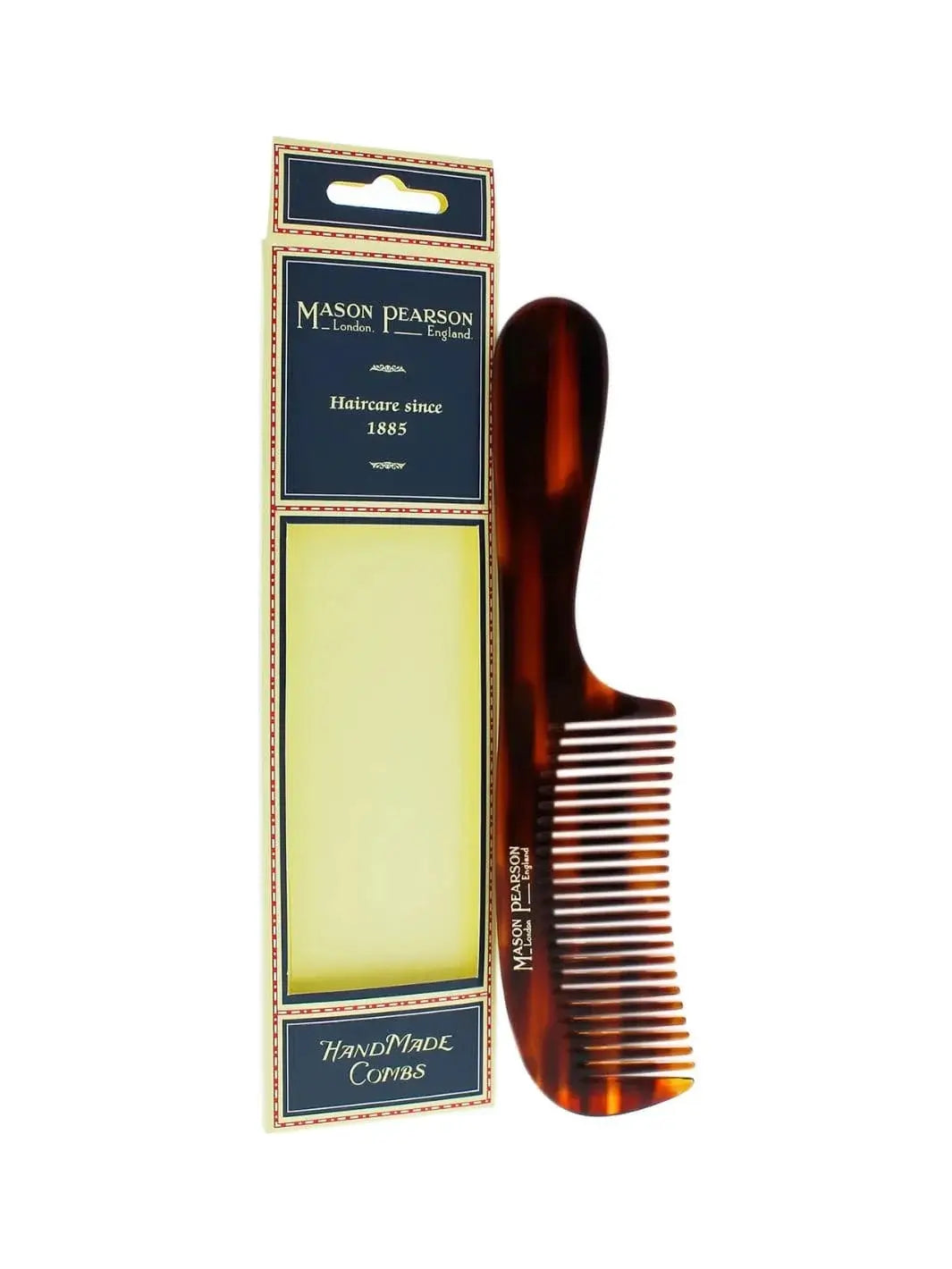 A premium tortoiseshell comb with a wide-tooth design and curved handle stands vertically next to its classic navy blue and cream retail box to showcase the Mason Pearson Detangling Comb C2 | Twentyseven Toronto