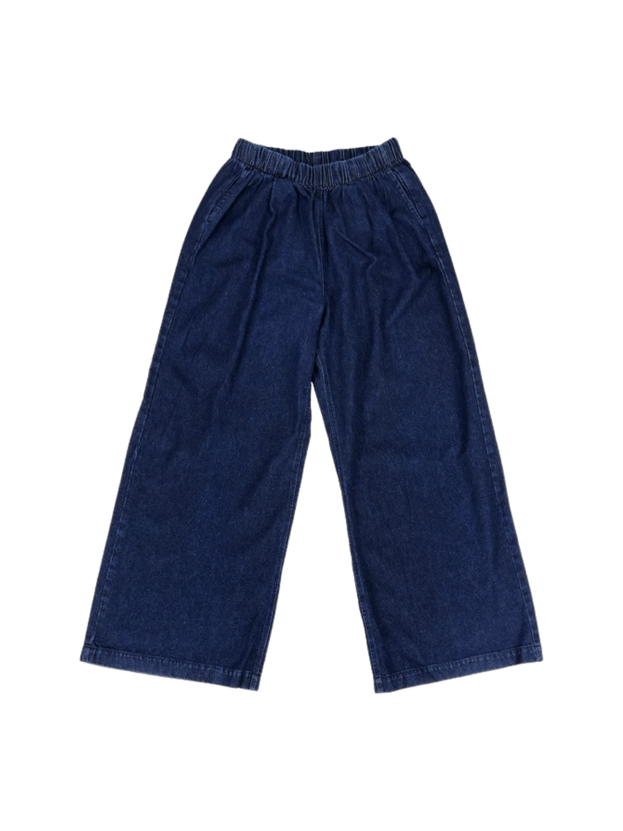 A flat lay product image displays the elastic waistband and relaxed, wide-leg silhouette of the dark blue Jungmaven Disco Denim Pant - Dark | Twentyseven Toronto