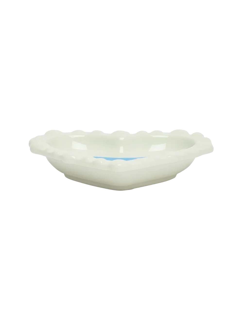 Side view of the Fishs Eddy x Susan Alexandra Duckie Dish, a heart-shaped glazed stoneware catchall with scalloped edges | Twentyseven Toronto