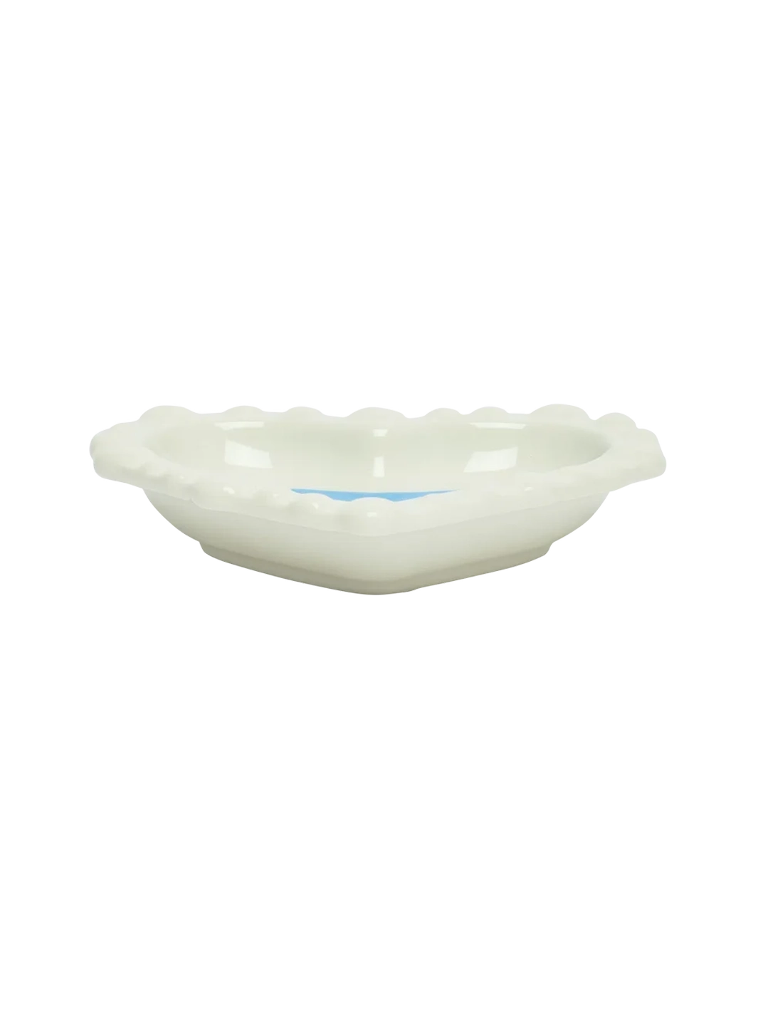 Side view of the Fishs Eddy x Susan Alexandra Duckie Dish, a heart-shaped glazed stoneware catchall with scalloped edges | Twentyseven Toronto