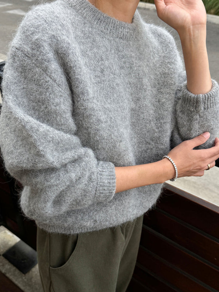 Le Bon Shoppe Elio Crew Neck Alpaca Sweater in Heather Grey styled with olive trousers, highlighting its soft brushed texture and relaxed fit | Twentyseven Toronto