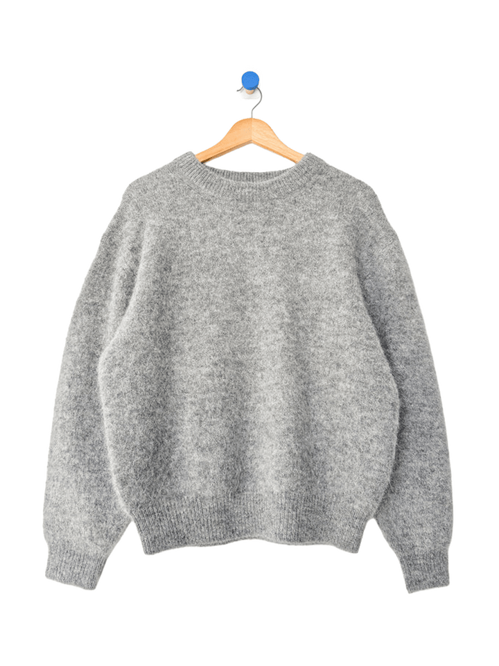 Le Bon Shoppe Elio Crew Neck Alpaca Sweater in Heather Grey displayed on a wooden hanger, featuring a classic crew neckline and boxy silhouette | Twentyseven Toronto