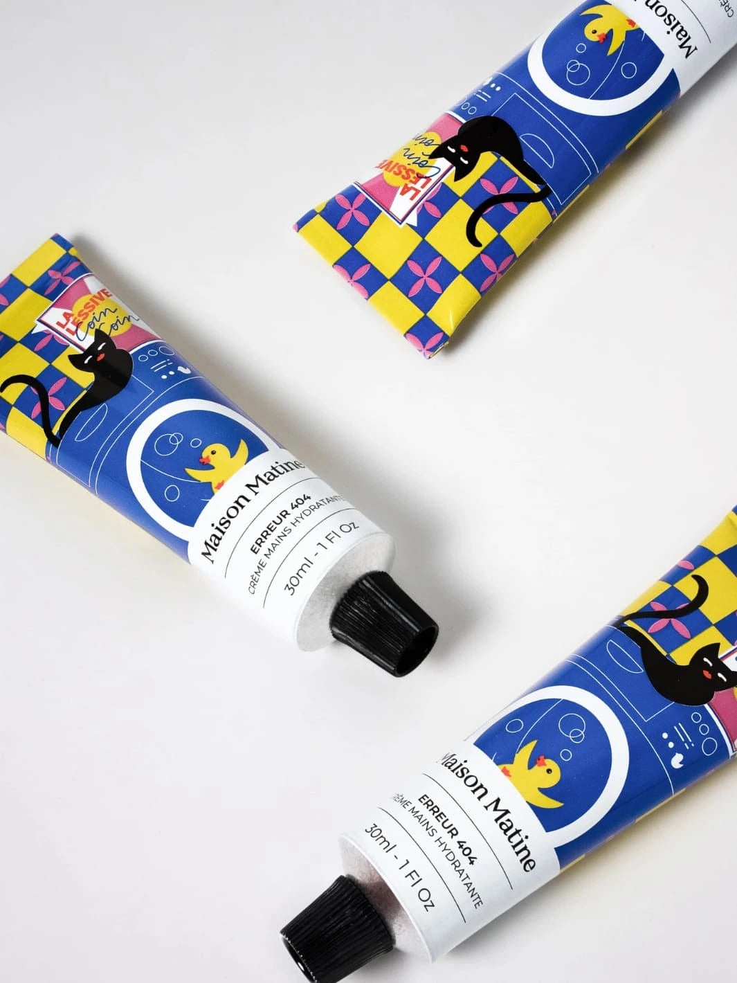 Three tubes of Maison Matine hand cream with colourful blue, pink and yellow packaging on a white background 30ml | Twentyseven Toronto