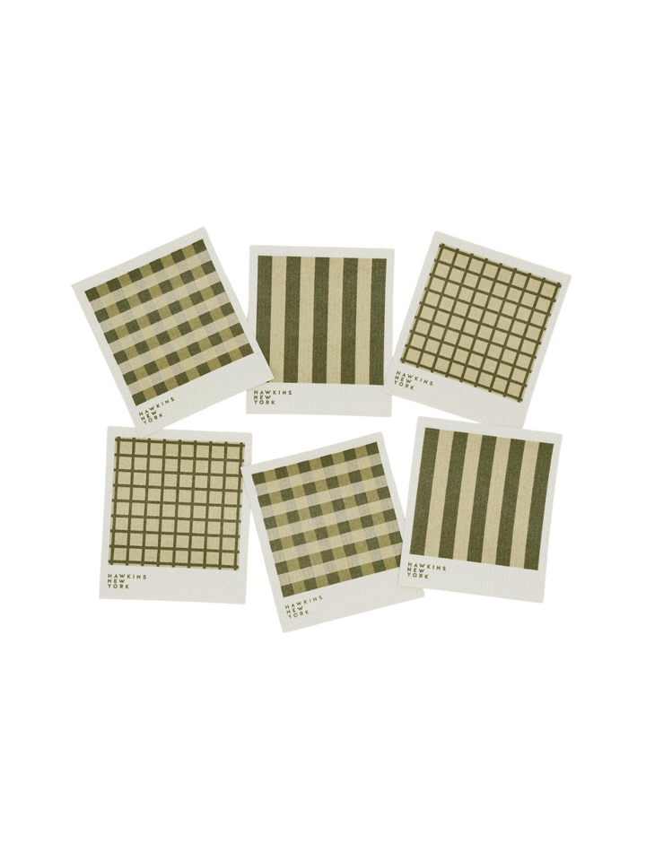 Six sponge cloths featuring assorted green plaid, striped, and windowpane patterns are arranged against a black background to showcase the complete Essential Swedish Dishcloth in Sage/Olive (Set of 6) from Hawkins New York | Twentyseven Toronto