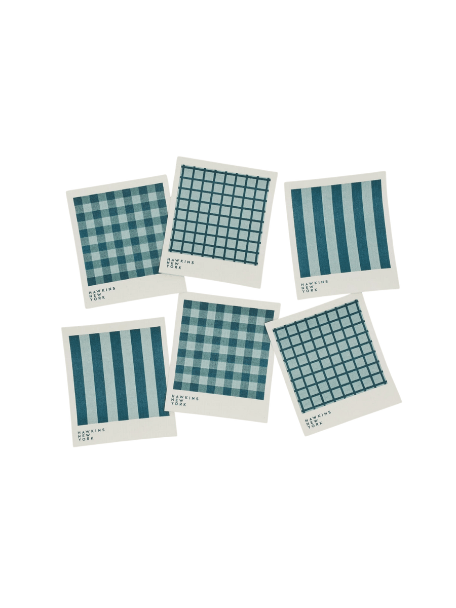 Six sponge cloths featuring assorted blue plaid, striped, and windowpane patterns are arranged against a black background to showcase the complete Essential Swedish Dishcloth in Sky/Peacock (Set of 6) from Hawkins New York | Twentyseven Toronto