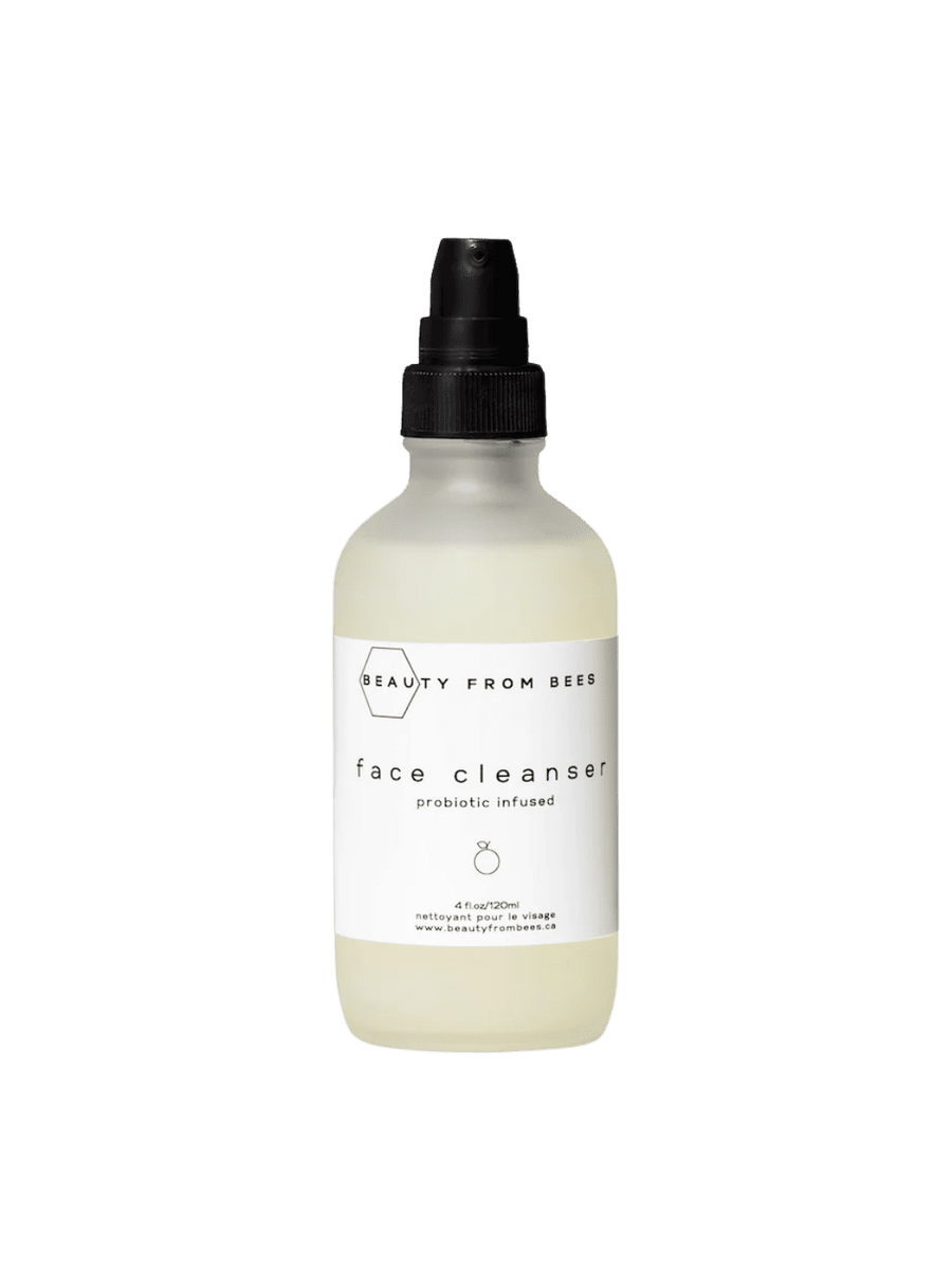 Bottle of Beauty from Bees Face Cleanser with a black spray nozzle on a transparent background | Twentyseven Toronto