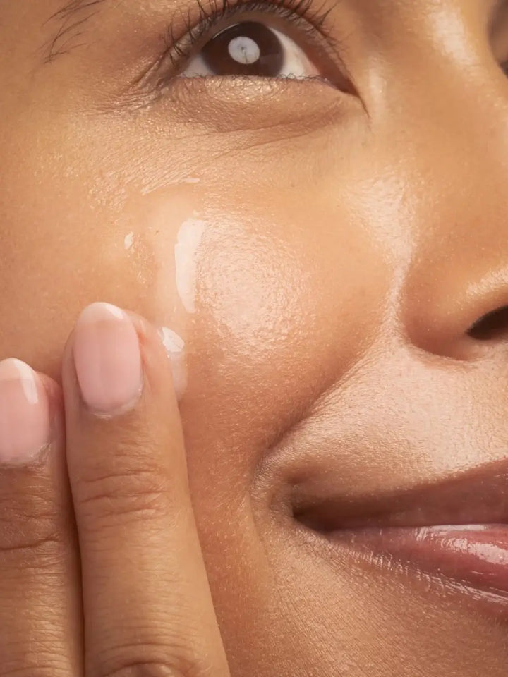 Close-up of a person applying Beauty from Bees Face Serum Hyaluronic Acid to their face | Twentyseven Toronto