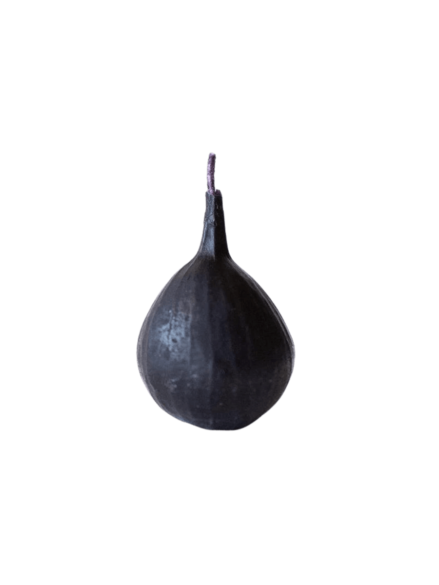 Fig-shaped beeswax candle from Happy Organics on a transparent background | Twentyseven Toronto