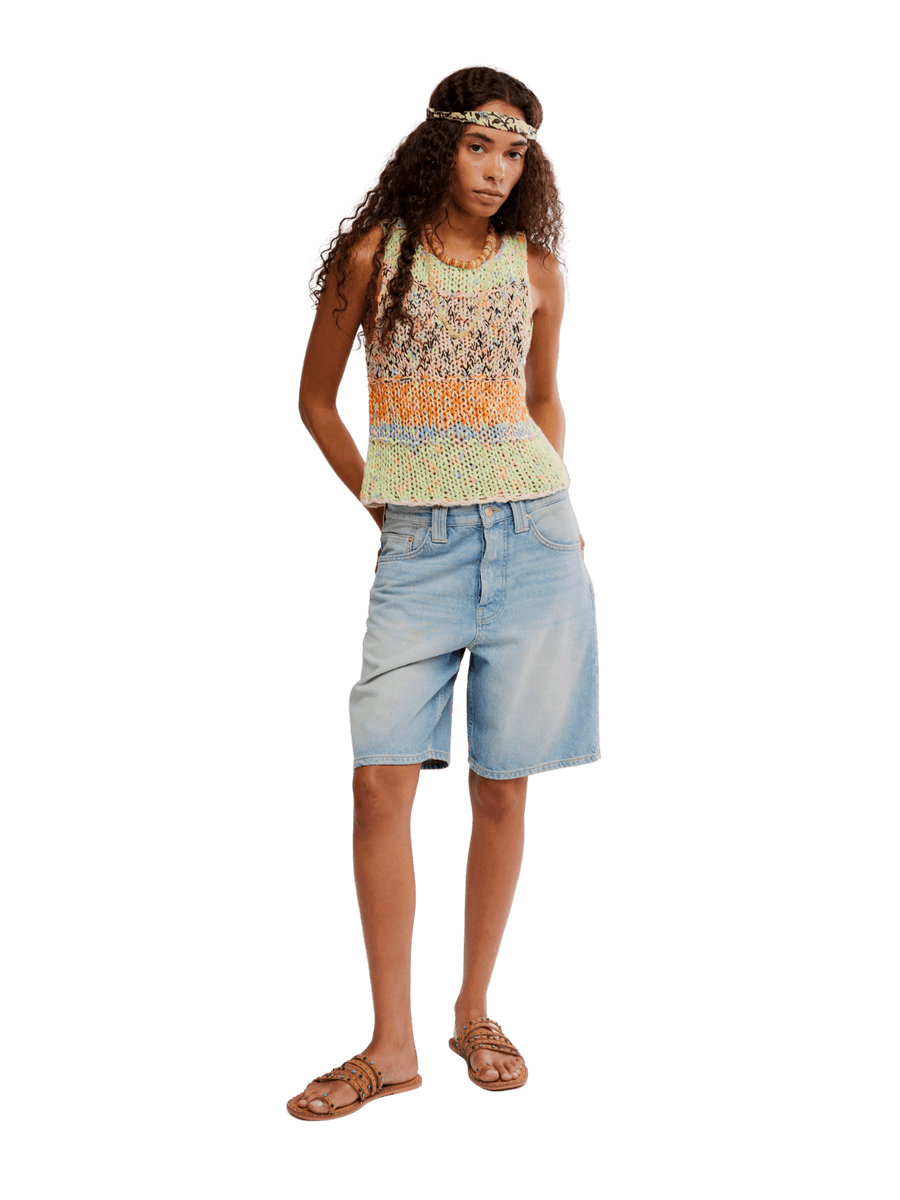 Woman wearing a colorful 'Flea Market Knot Tank' sleeveless top in 'Paradise Combo' and denim shorts on a transparent background | Twentyseven Toronto