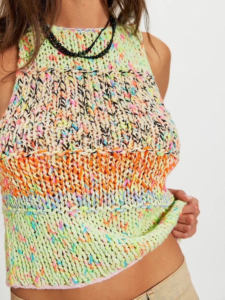 Close up of woman wearing a colorful 'Flea Market Knot Tank' sleeveless top in 'Paradise Combo' on a white background | Twentyseven Toronto