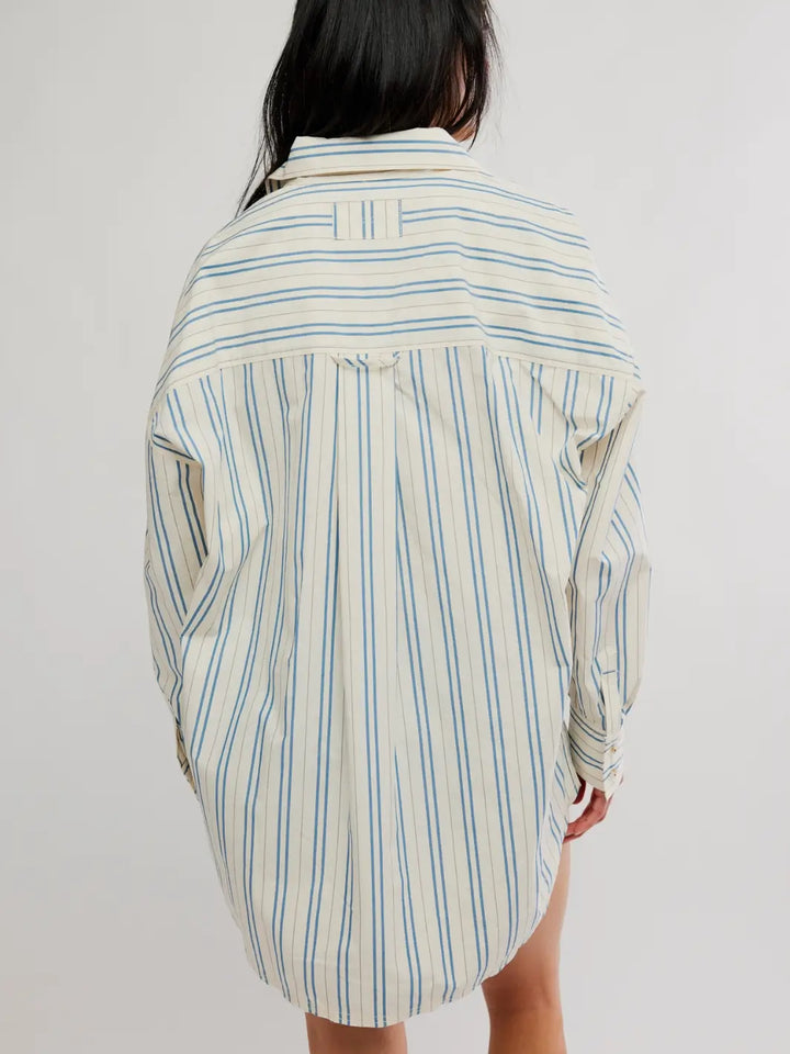 A rear view captures the relaxed silhouette, horizontal stripe yoke, and back pleat detail of the Free People We the Free Freddie Striped Shirt in Ivory Combo | Twentyseven Toronto