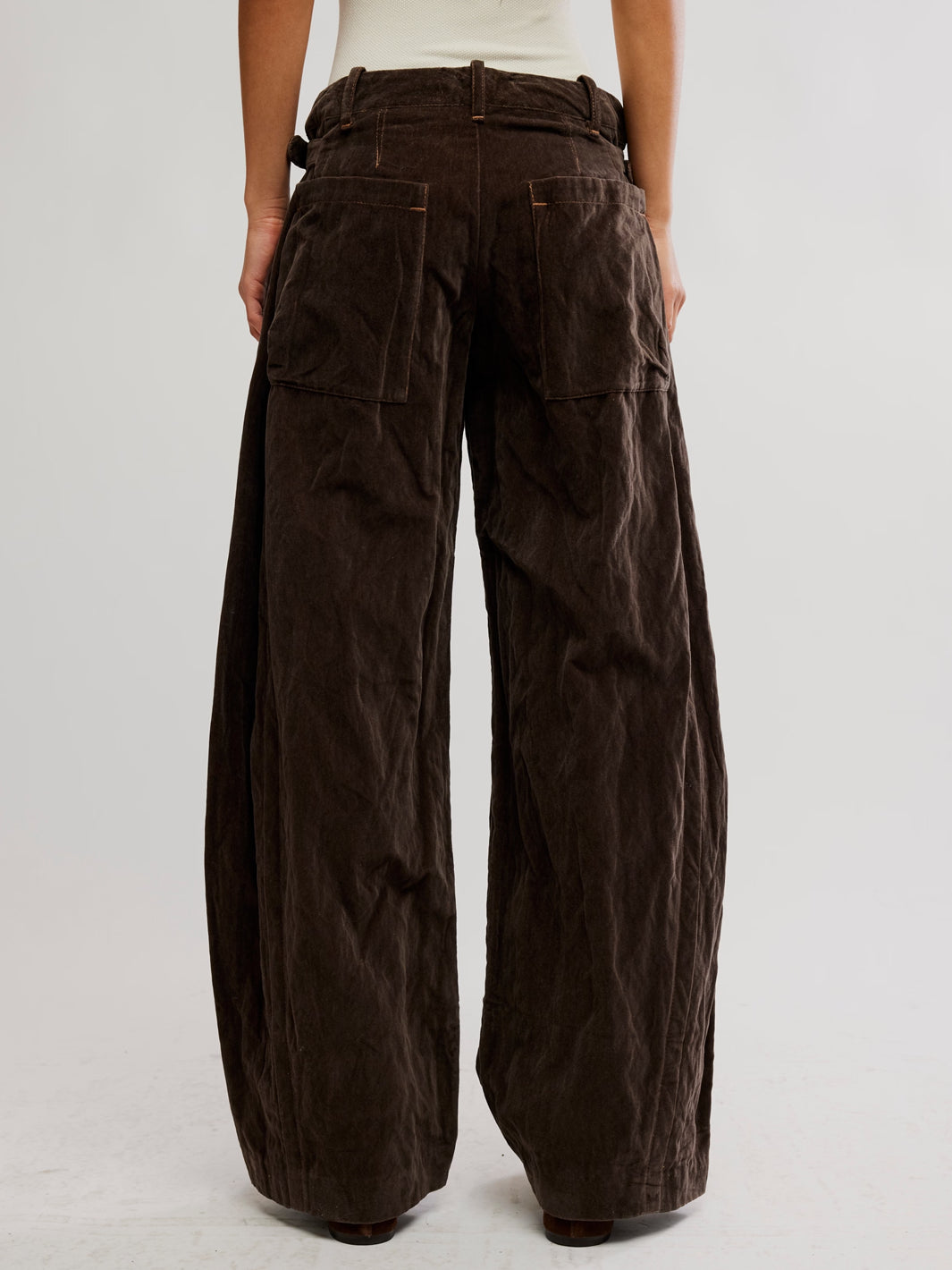 Free People Holding Onto This Trouser in brown, featuring a wide-leg silhouette and oversized back patch pockets | Twentyseven Toronto