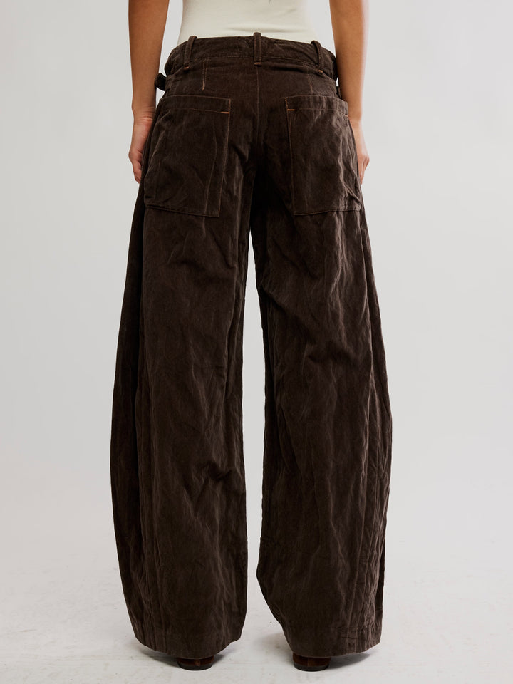 Free People Holding Onto This Trouser in brown, featuring a wide-leg silhouette and oversized back patch pockets | Twentyseven Toronto