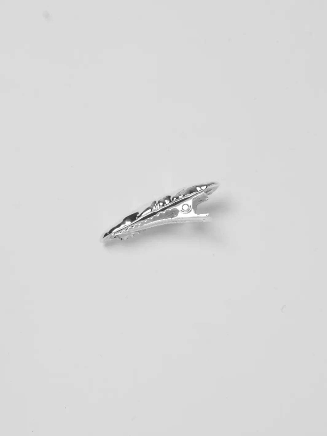 A side angle of the Frida Clip in Silver from Wolf Circus showing its alligator clasp mechanism on a white background | Twentyseven Toronto