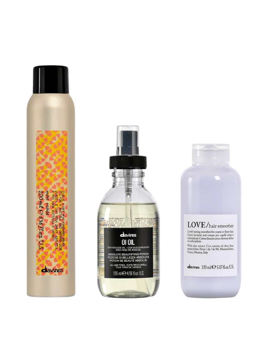 Set of three Davines hair care products including This is a Dry Wax Finishing Spray (200ml), OI Oil (135ml), LOVE Hair Smoother (150ml) on a transparent background | Twentyseven Toronto